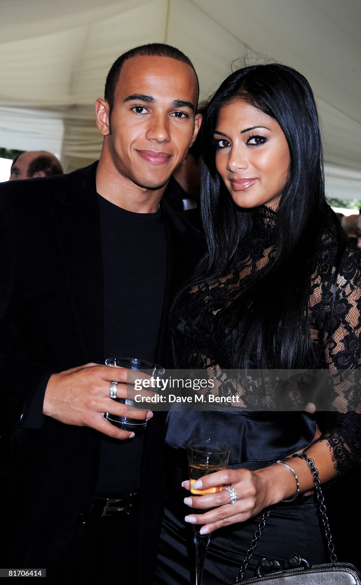 Lewis Hamilton and Nicole Scherzinger attend the dinner in honour of Nelson Mandela, celebrating his 90th birthday, at Hyde Park in London, England, on 25 June 2008. 