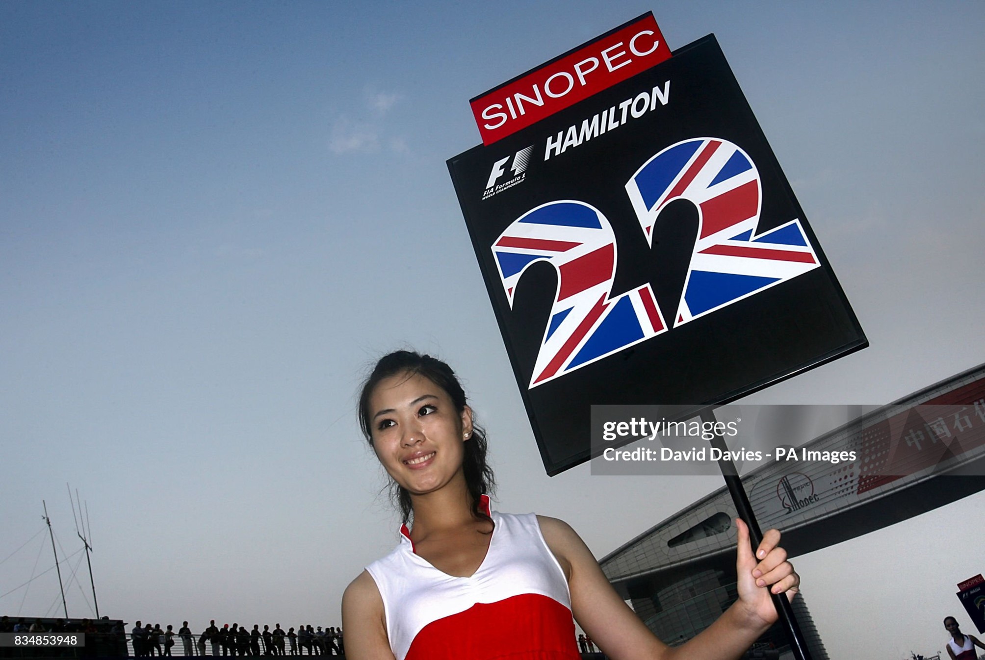 A grid girl holds up a board for McLaren Mercedes' Lewis Hamilton before the start of the F1Chinese Grand Prix at the Shanghai International Circuit on 19 October 2008. 