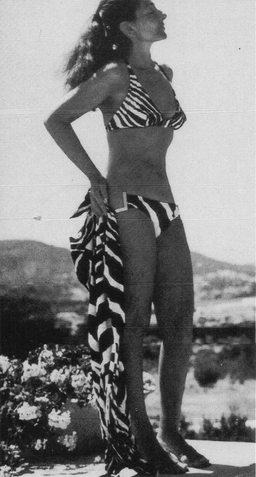 Maria Callas in a bikini caught with a long lens by one of the many paparazzi stalking her in the early 1960's as she vacationed with Aristotle Onassis on his private yacht.