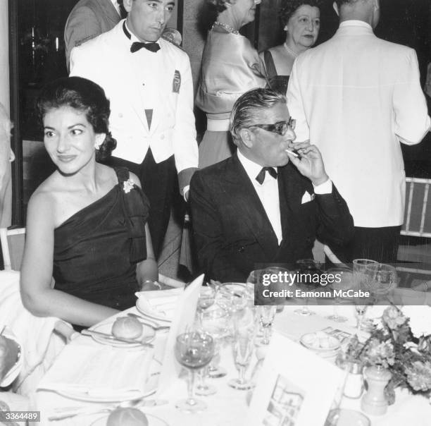 Singer Maria Callas (1923 - 1977) dining with Aristotle Onassis (1906 - 1975) in 1961. 