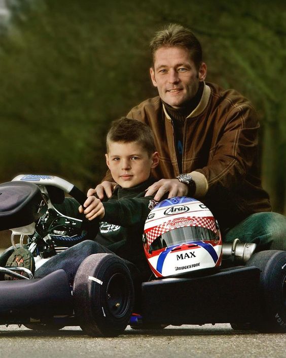 A young Max Verstappen in a kart with his father Jos.