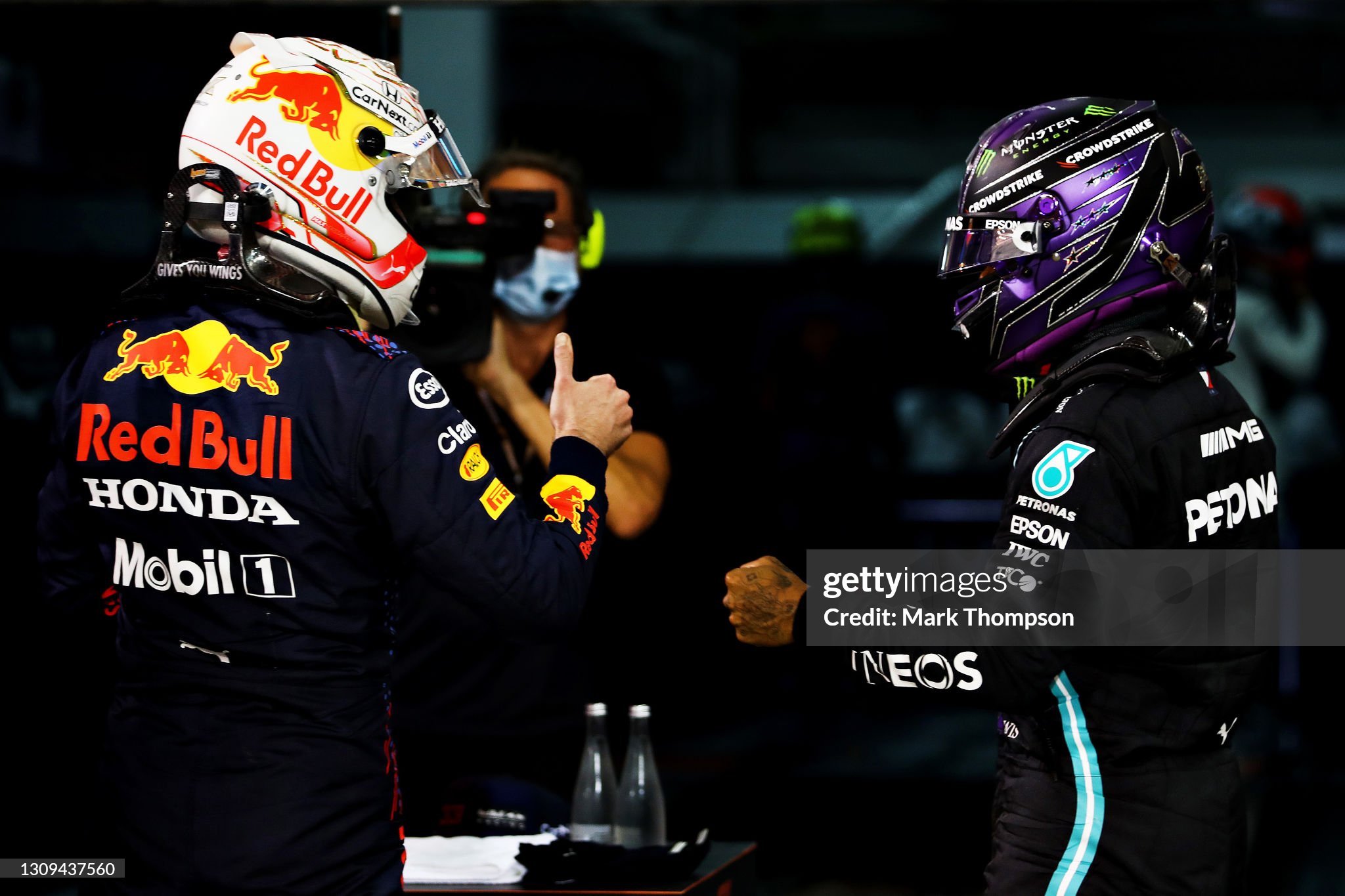 Pole position qualifier Max Verstappen of Netherlands and Red Bull Racing and second place qualifier Lewis Hamilton of Great Britain and Mercedes celebrate in parc ferme after qualifying ahead of the F1 Grand Prix of Bahrain at Bahrain International Circuit on March 27, 2021. 