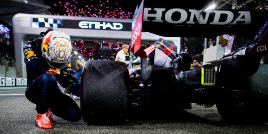 Race winner and 2021 F1 World Drivers Champion Max Verstappen of the Netherlands and Red Bull Racing celebrates in parc ferme after the F1 Grand Prix of Abu Dhabi at Yas Marina Circuit on December 12, 2021 in Abu Dhabi, United Arab Emirates.