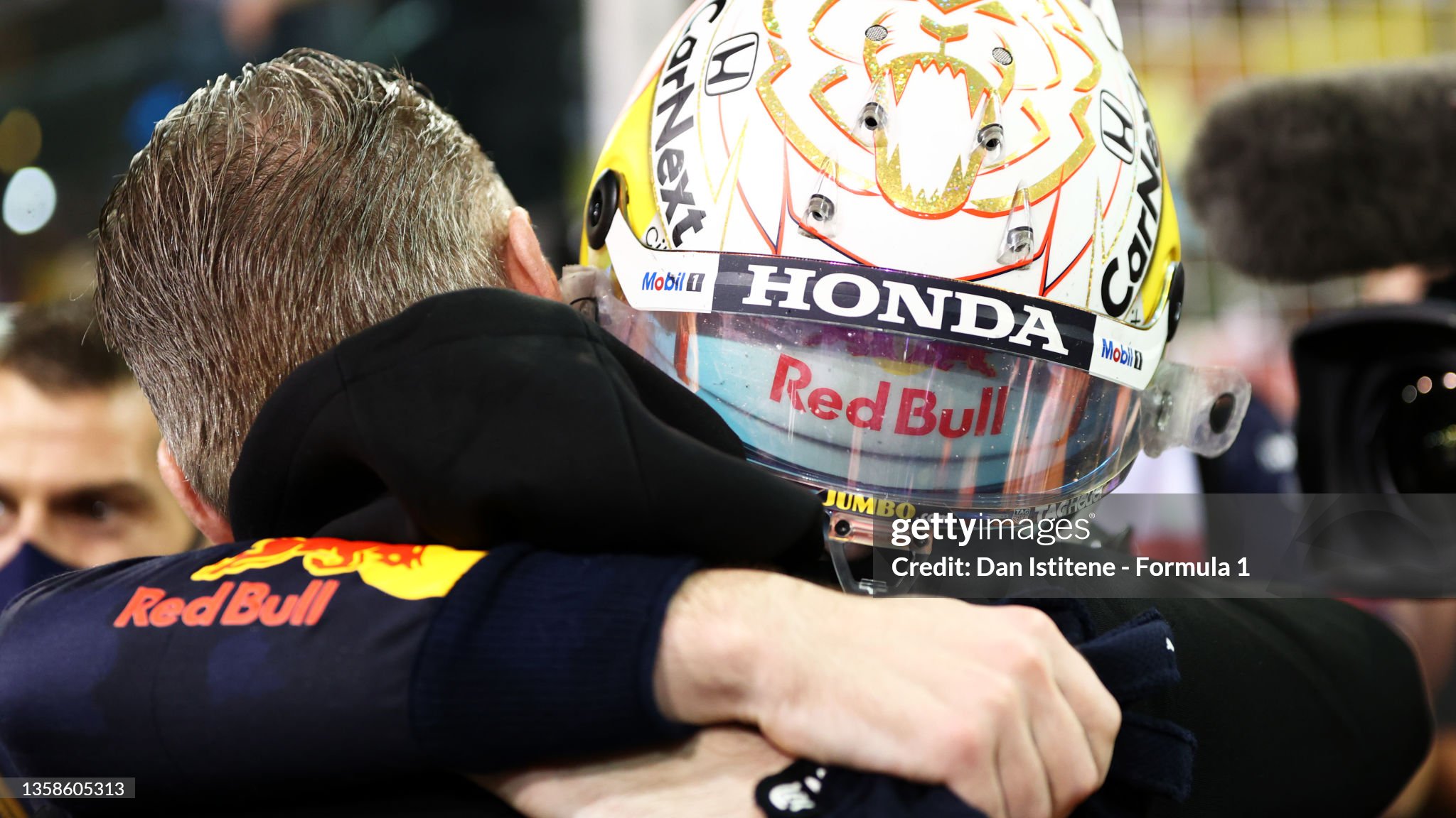 Race winner and 2021 F1 World Drivers Champion Max Verstappen celebrates with his father Jos Verstappen in parc ferme after the F1 Grand Prix of Abu Dhabi at Yas Marina Circuit on December 12, 2021. 