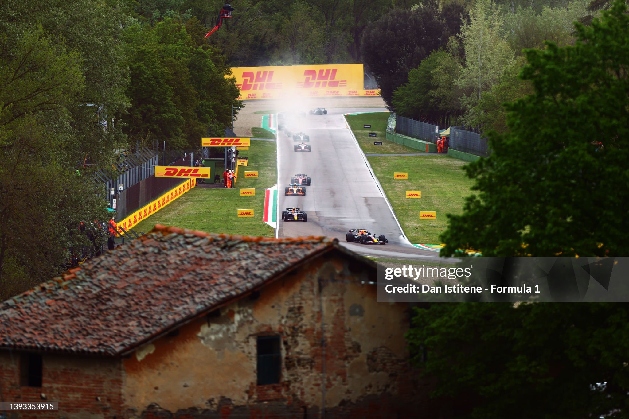 Max Verstappen leads Sergio Perez and the rest of the field on lap one during the F1 Grand Prix of Emilia Romagna at Autodromo Enzo e Dino Ferrari on April 24, 2022 in Imola, Italy. 