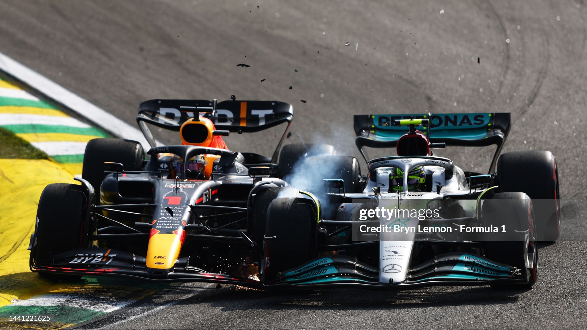 Max Verstappen driving the Red Bull RB18 and Lewis Hamilton driving the Mercedes AMG W13 collide during the F1 Grand Prix of Brazil at Autodromo Jose Carlos Pace on November 13, 2022 in Sao Paulo, Brazil. 