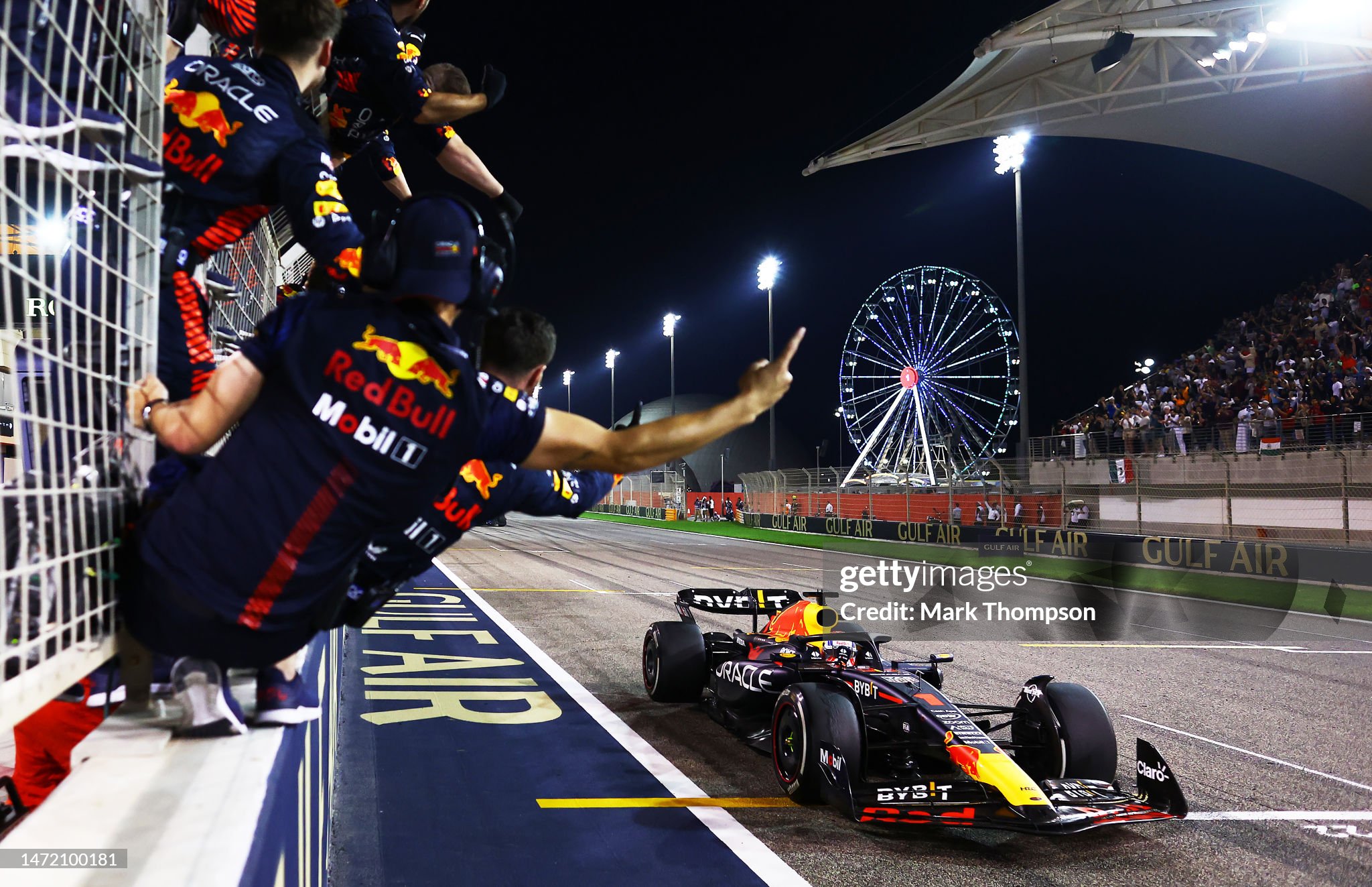 Race winner Max Verstappen driving the Red Bull RB19 passes his team celebrating on the pitwall during the F1 Grand Prix of Bahrain at Bahrain International Circuit on March 05, 2023. 