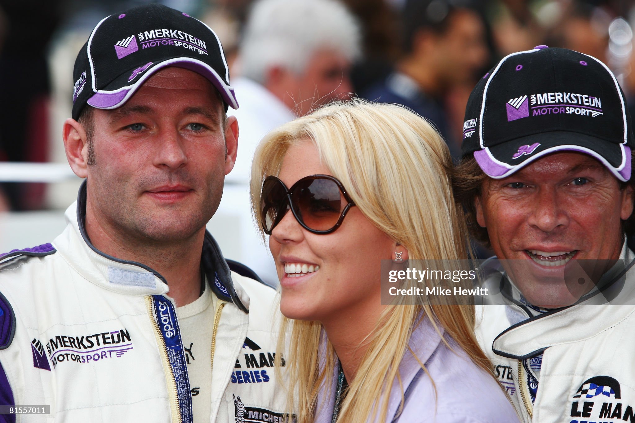 Van Merksteijn Motorsport drivers Jos Verstappen and Peter Van Merksteijn of the Netherlands pose for a photograph with a female guest while attending the drivers parade in Le Mans town centre prior to the 76th running of the Le Mans 24 Hour race at the Circuit des 24 Heures du Mans on 13 June 2008 in Le Mans, France. 