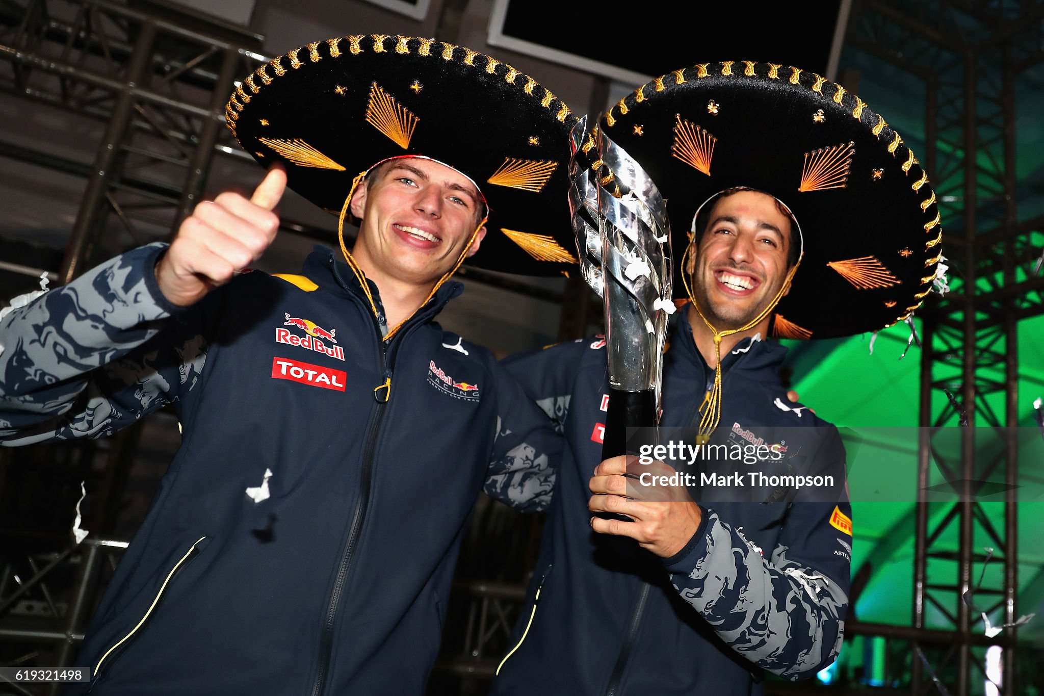 Daniel Ricciardo of Australia and Red Bull Racing celebrates getting third position with Max Verstappen of the Netherlands and Red Bull Racing after Sebastian Vettel of Germany and Ferrari was given a 10 second penalty following a stewards enquiry during the Formula One Grand Prix of Mexico at Autodromo Hermanos Rodriguez on October 30, 2016. 