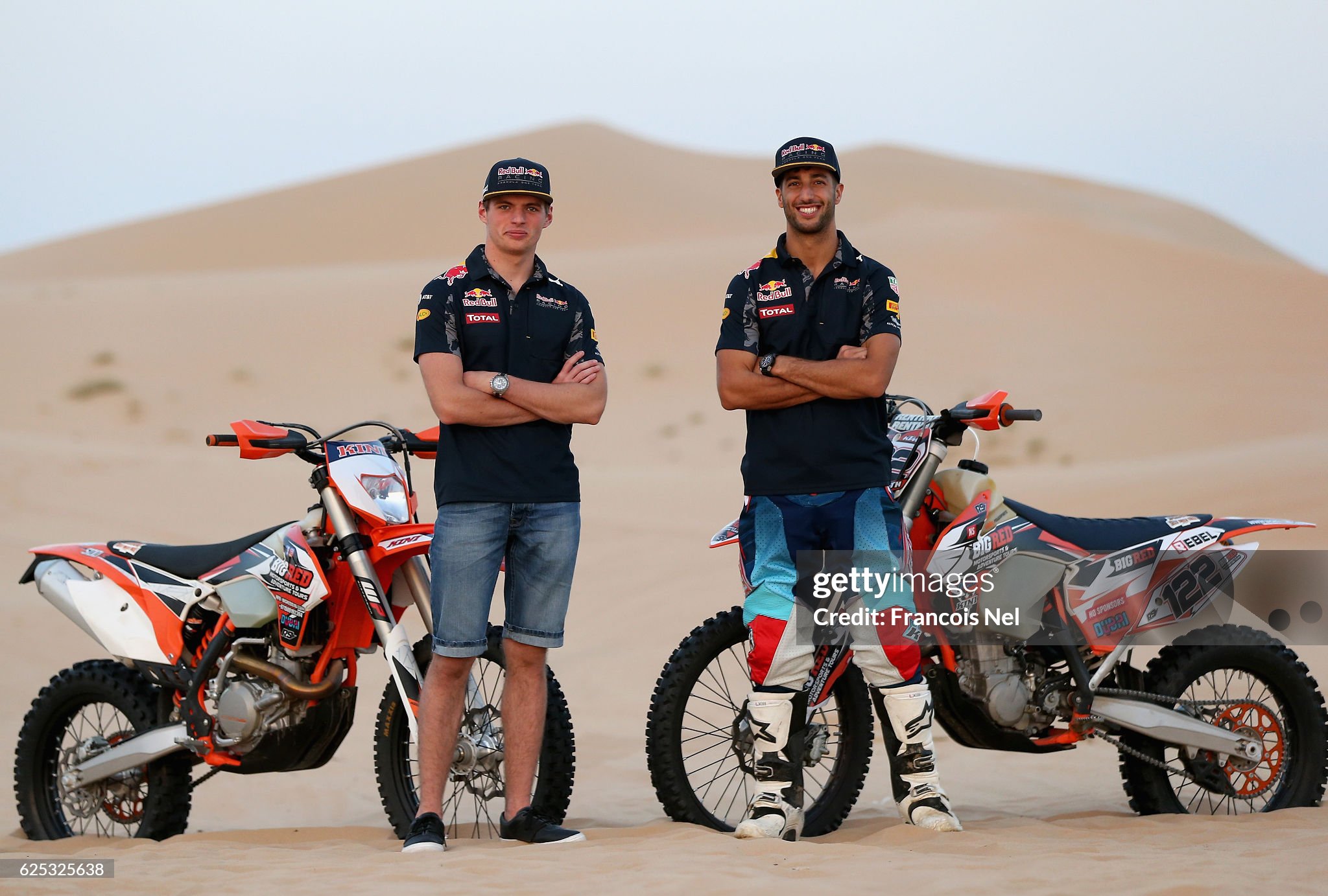 Max Verstappen and Daniel Ricciardo pose for a photograph during the Red Bull Racing Sunset Sands on 23 November 2016 in Abu Dhabi, United Arab Emirates. 