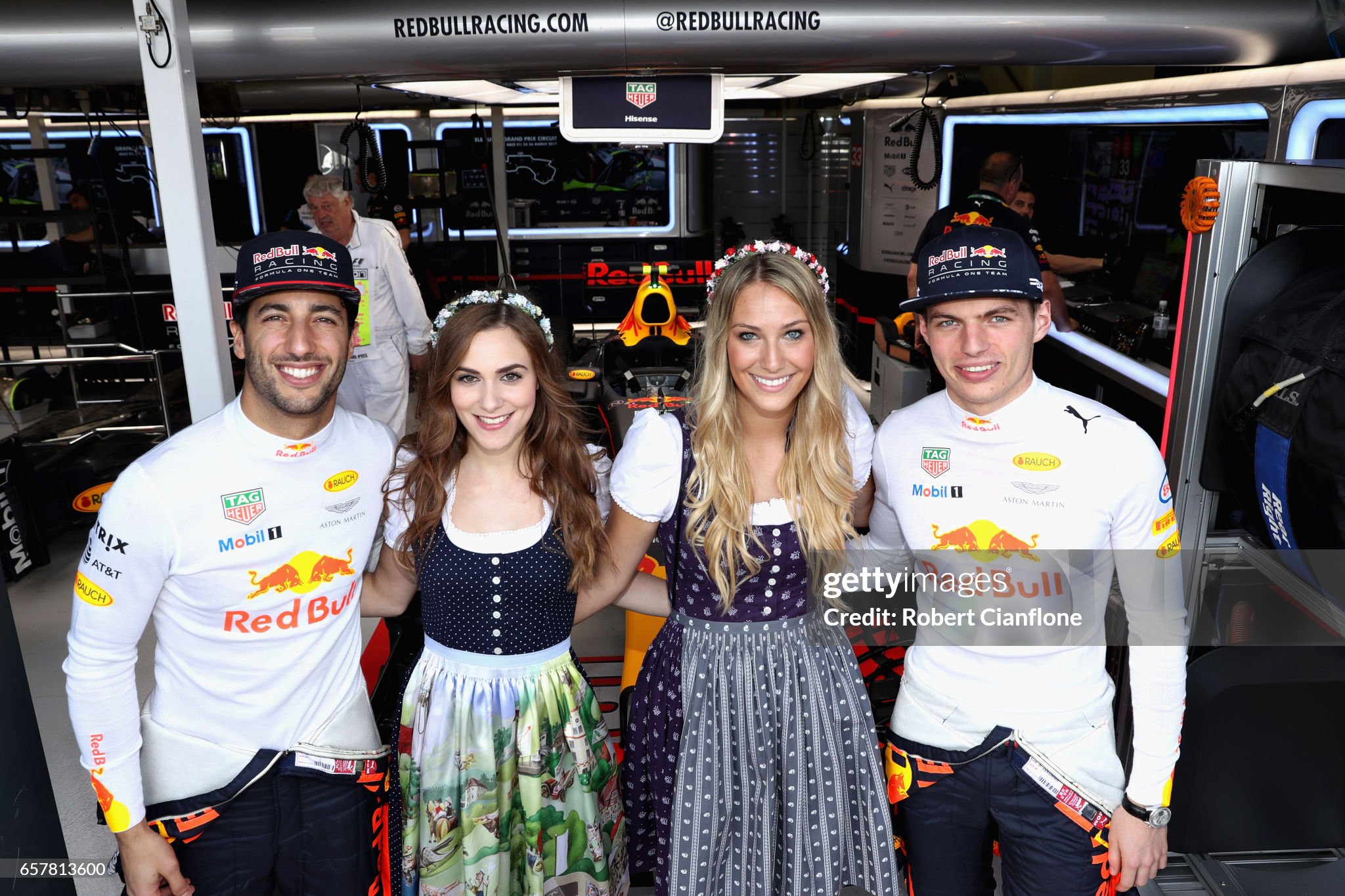 Daniel Ricciardo and Max Verstappen meet the Red Bull Racing Formula Unas outside the Red Bull Racing garage before the Australian F1 Grand Prix at Albert Park on March 26, 2017 in Melbourne. 