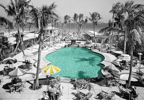 Colorized vintage image of the pool at the Hotel Raleigh in Miami circa 1941. 