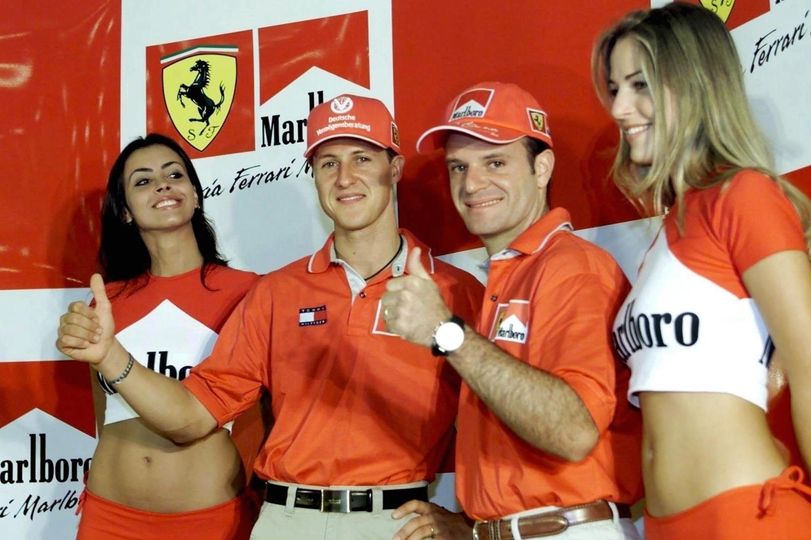 13 March 2000, Brazilian Grand Prix in Sao Paulo. Michael Schumacher with Rubens Barrichello and girls. 