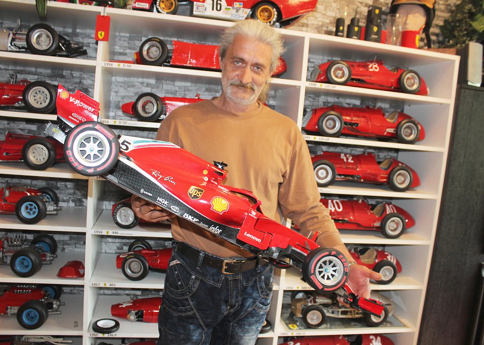Milan Paulus with a paper model of a Ferrari car