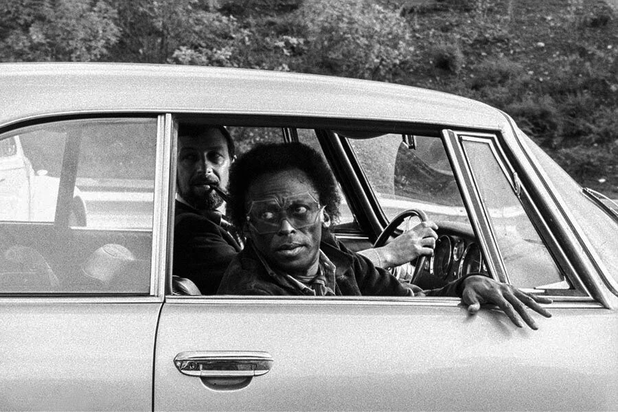 Miles Davis in a car.