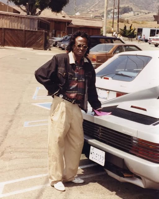 Miles Davis and his 1987 Ferrari Testarossa with the Californian license plate MILES22.