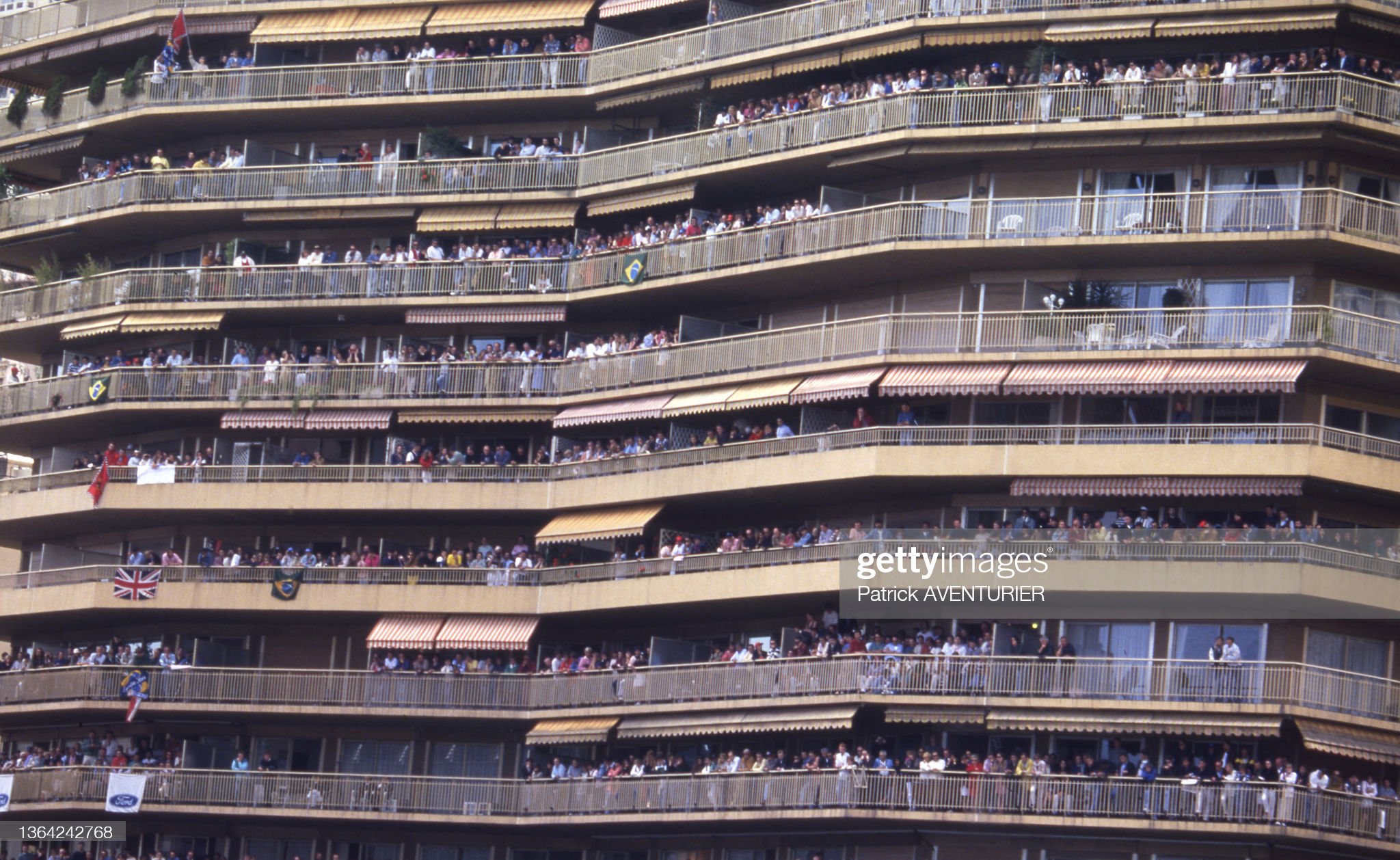 The crowds watch from the balconies of buildings at the Monaco Grand Prix in 1989.
