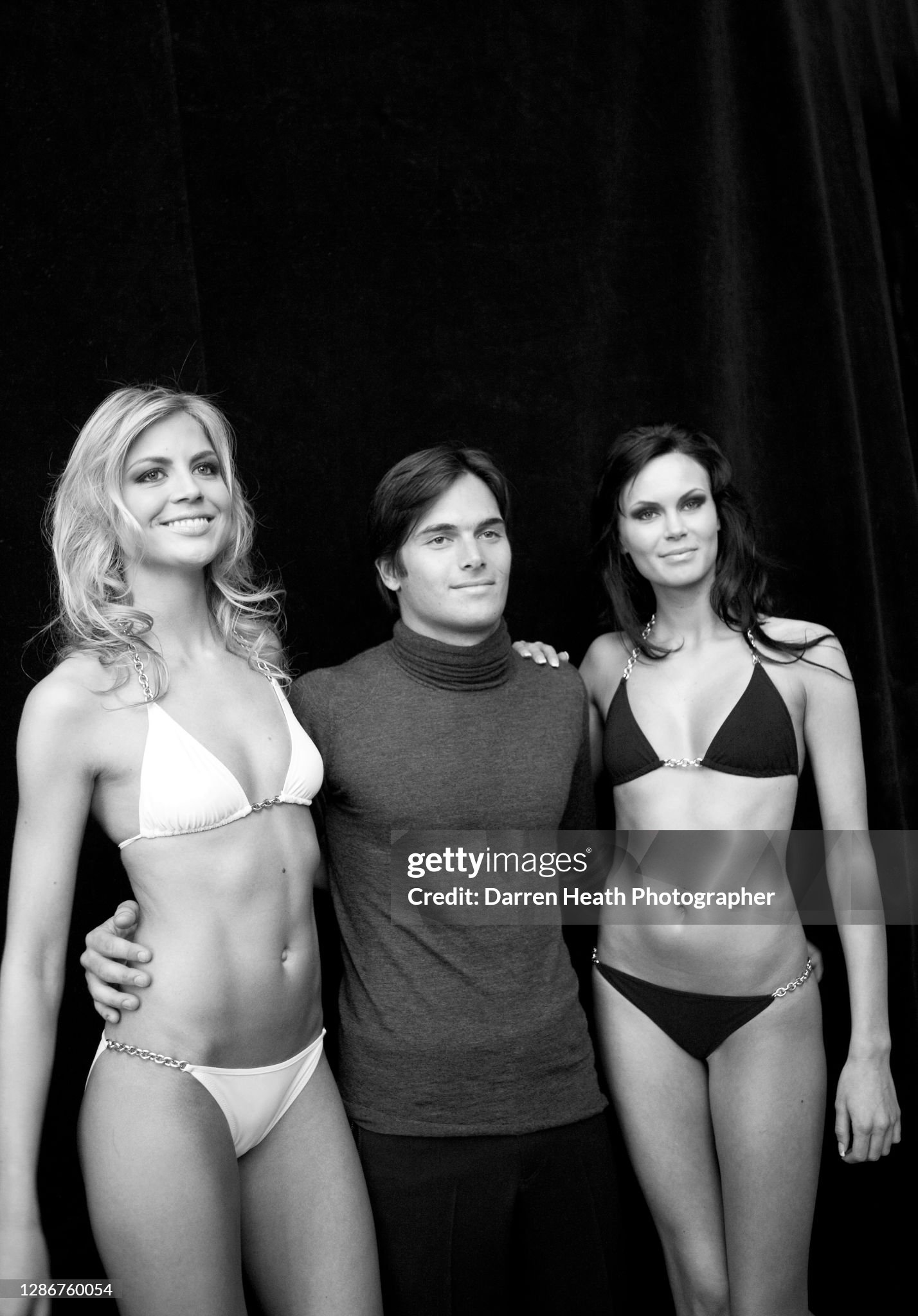 Nelson Piquet Junior with two catwalk fashion models before appearing at the Amber Fashion show at the Monaco Grand Prix in Monte Carlo on 21 May 2009. 
