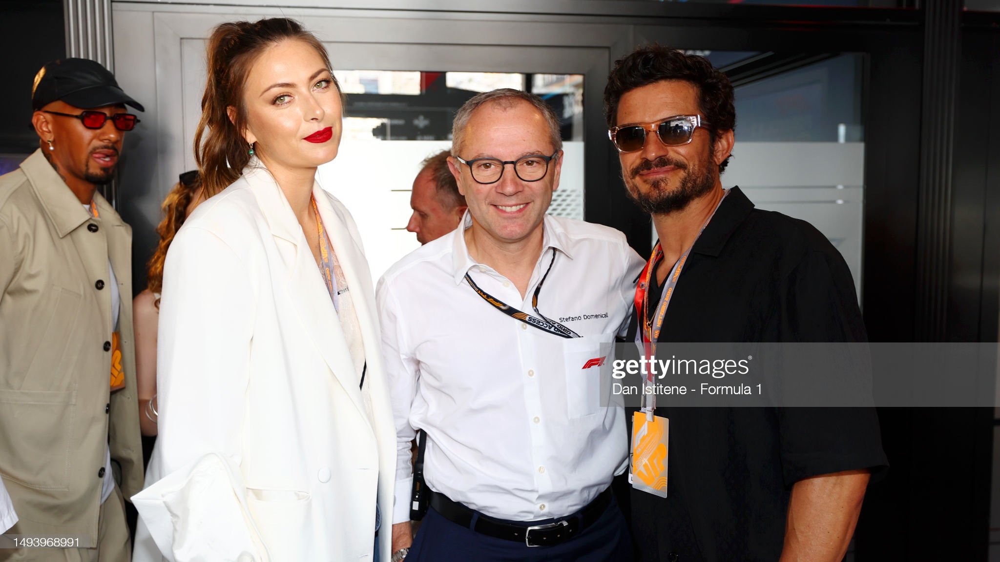 Maria Sharapova, Stefano Domenicali and Orlando Bloom pose for a photo in the paddock during the F1 Grand Prix of Monaco on May 28, 2023.