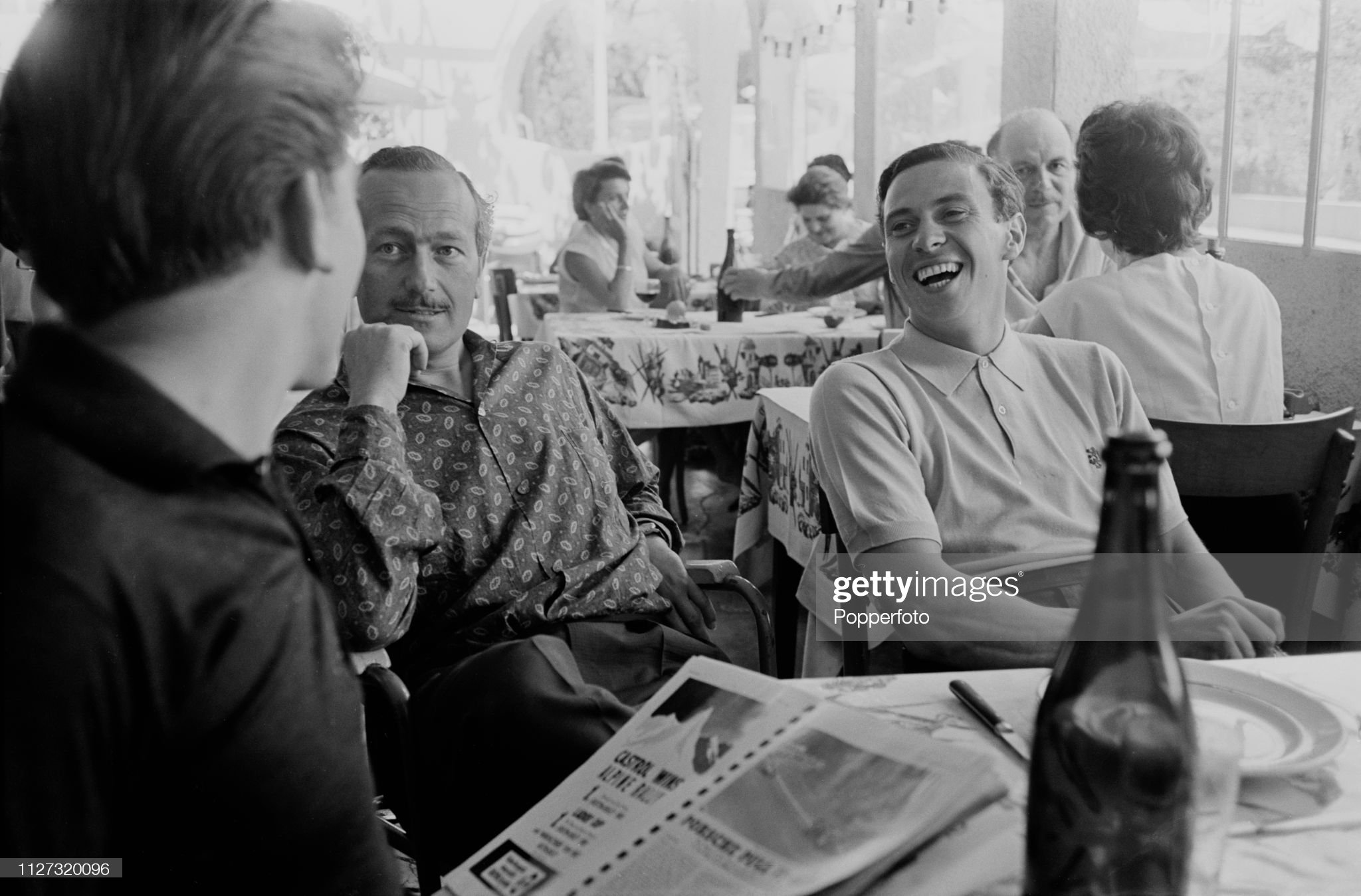 Jim Clark with Colin Chapman in a restaurant prior to competing in the n.9 Lotus 25 Climax V8 to finish in 8th place in the Monaco GP in Monte Carlo on 26th May 1963. 