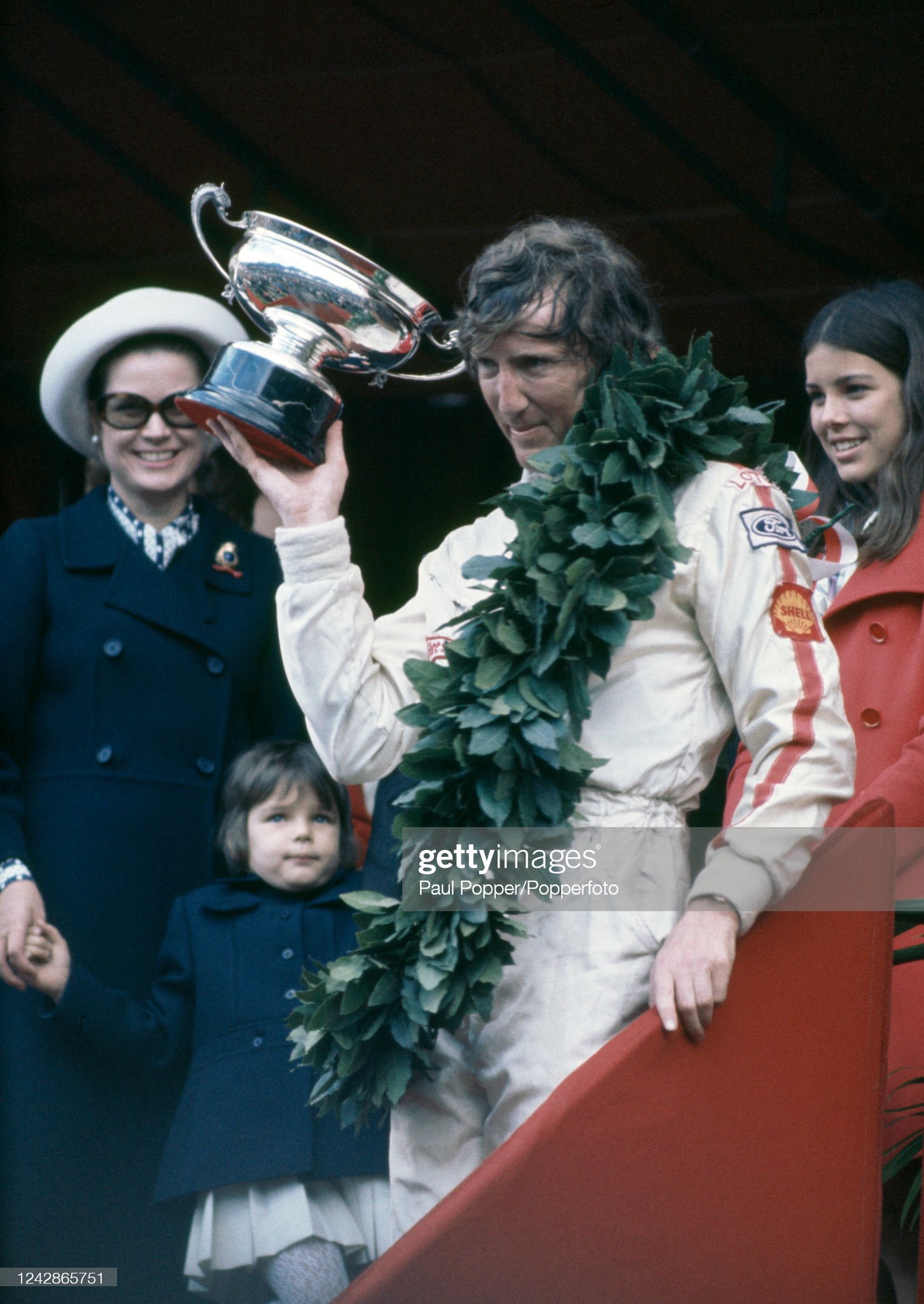 Jochen Rindt, representing Lotus-Ford, celebrates with the trophy after winning the Monaco Grand Prix at the Circuit du Monaco on May 10, 1970 in Monte Carlo, Monaco.