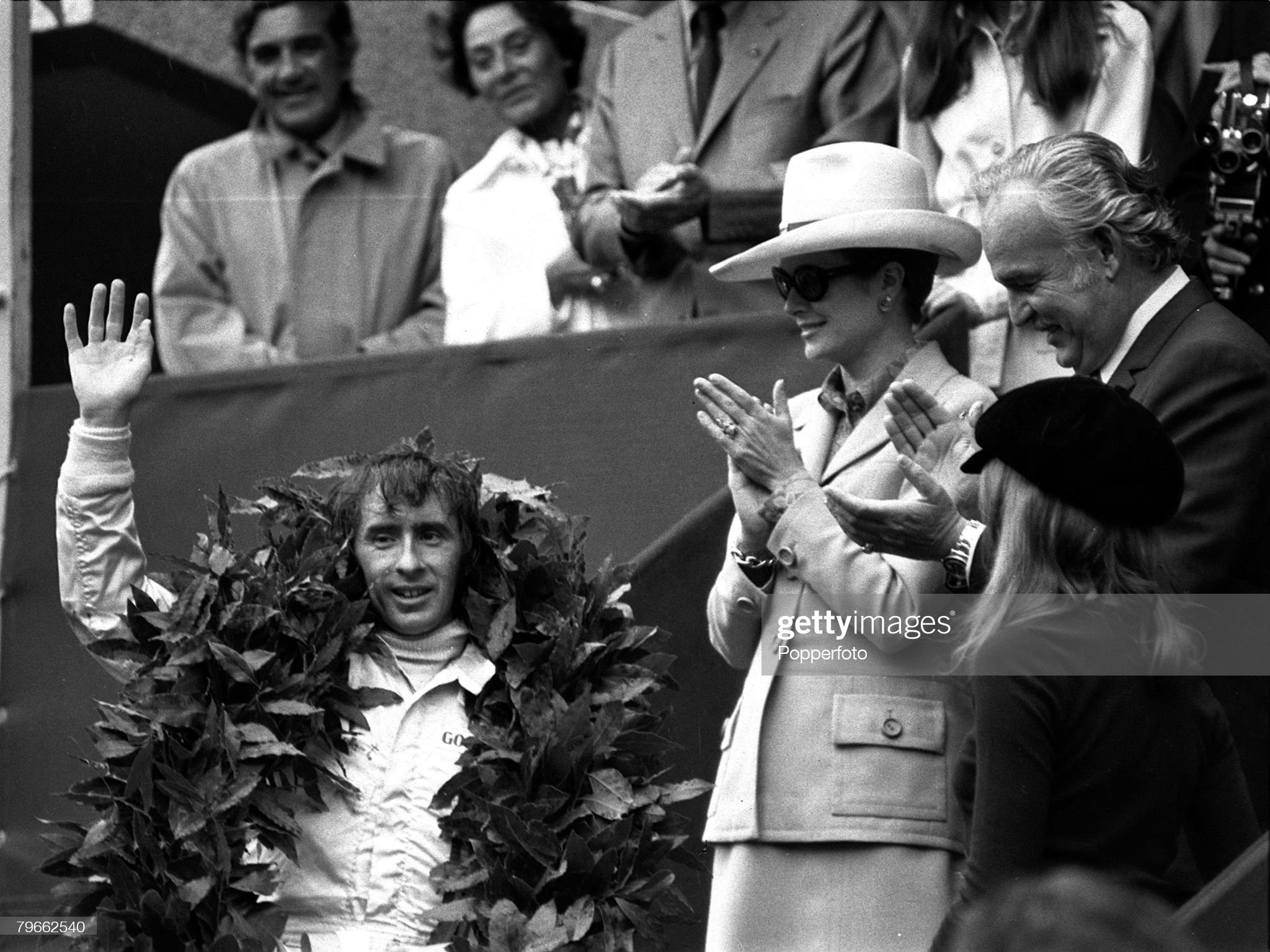 23rd May 1971, Formula One Monaco Grand Prix, Scotland's Jackie Stewart is applauded by Princess Grace and Prince Rainier of Monaco after winning the race in his Tyrell Ford. 