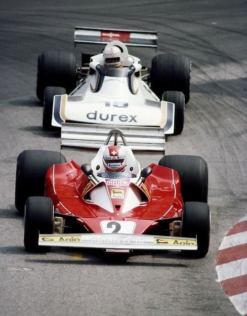 Clay Regazzoni drives the #2 Scuderia Ferrari 312T2 ahead of Alan Jones driving the #19 Durex Team Surtees Ford TS19 during the Grand Prix of Monaco on 30 May 1976. 