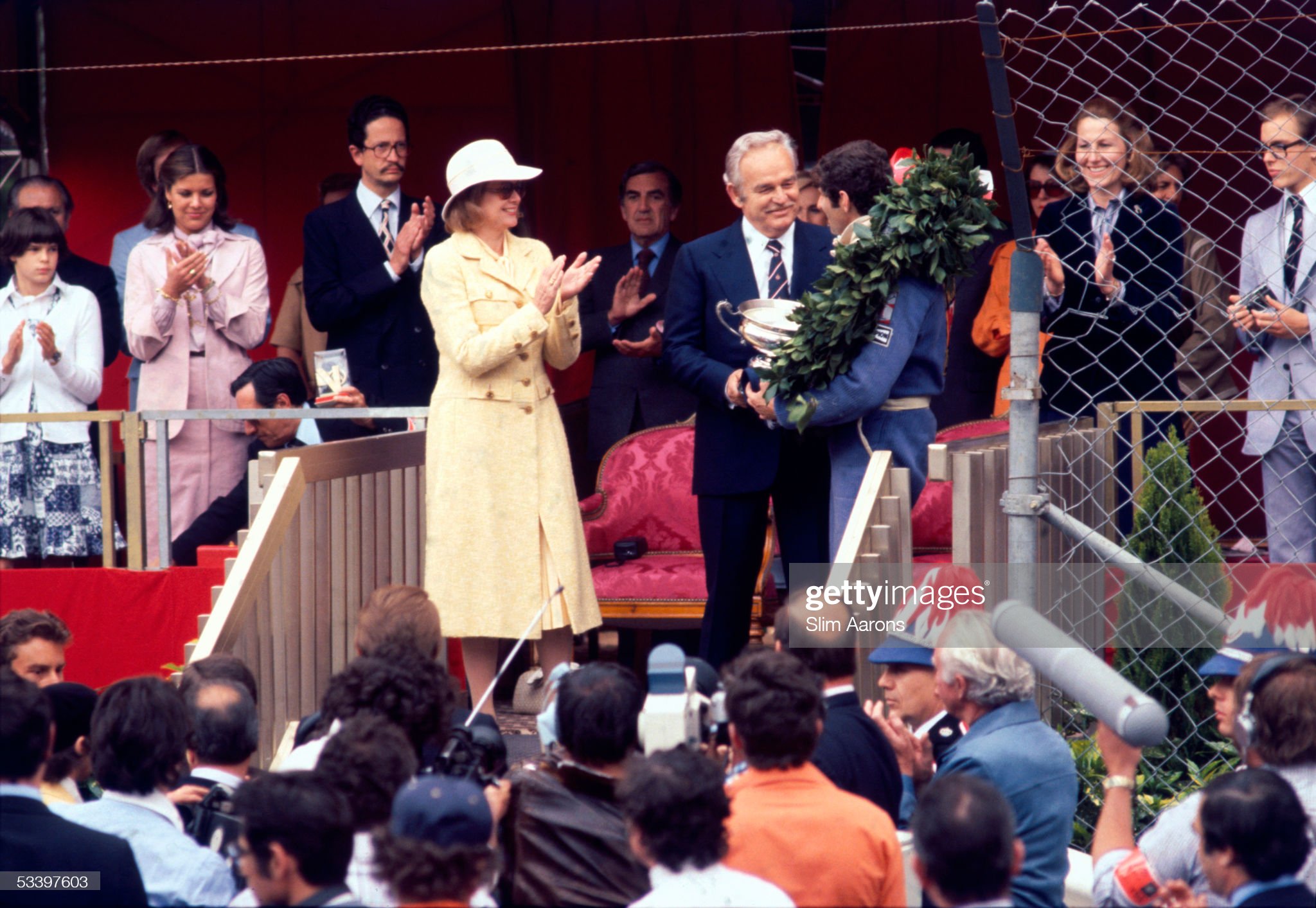 Princesses Stephanie, Caroline and Grace of Monaco applaud as Prince Rainier III gives the trophy to Jody Scheckter after his victory in the Monaco Grand Prix on 22nd May 1977.