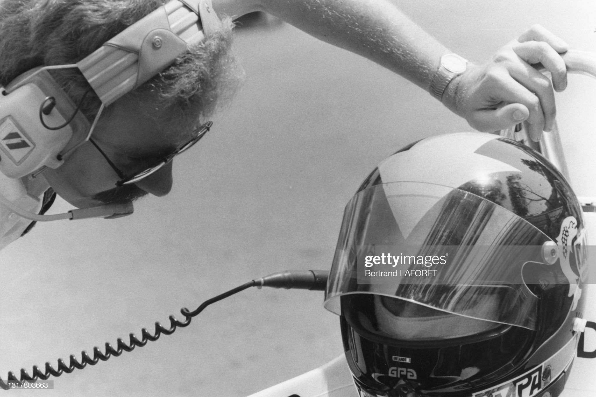 A technician talking with a driver during practice for the Monaco Grand Prix on May 20, 1982.