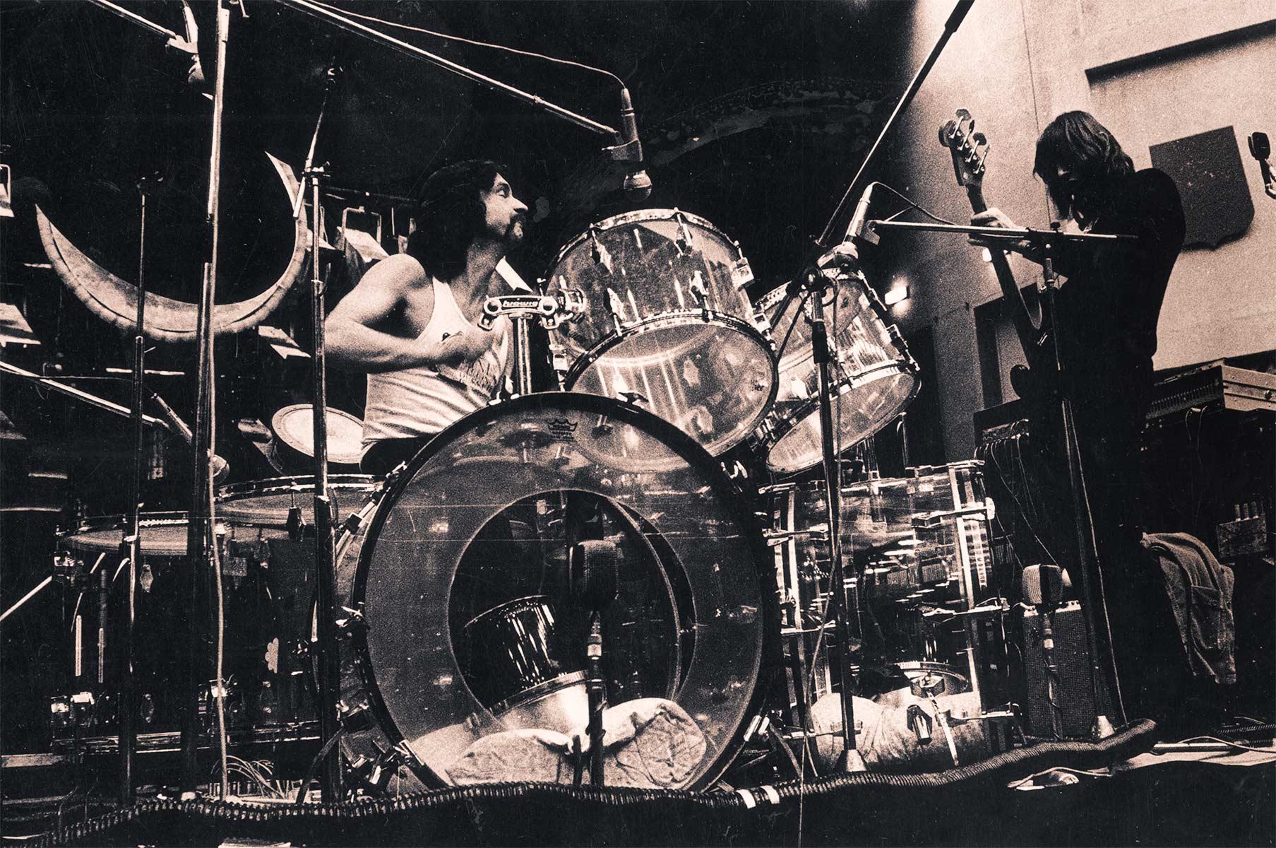 Nick Mason playing drums.