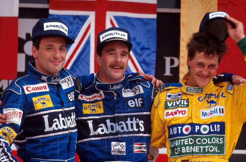 Riccardo Patrese and Nigel Mansell share the podium with Michael Schumacher at the 1992 Mexican GP.