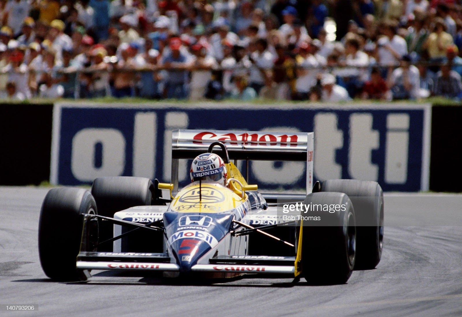 Nigel Mansell drives the n.5 Canon Williams FW11B Honda RA167E 1.5 V6t during the Shell Oils British Grand Prix on 12th July 1987 at the Silverstone Circuit in Towcester, Great Britain.