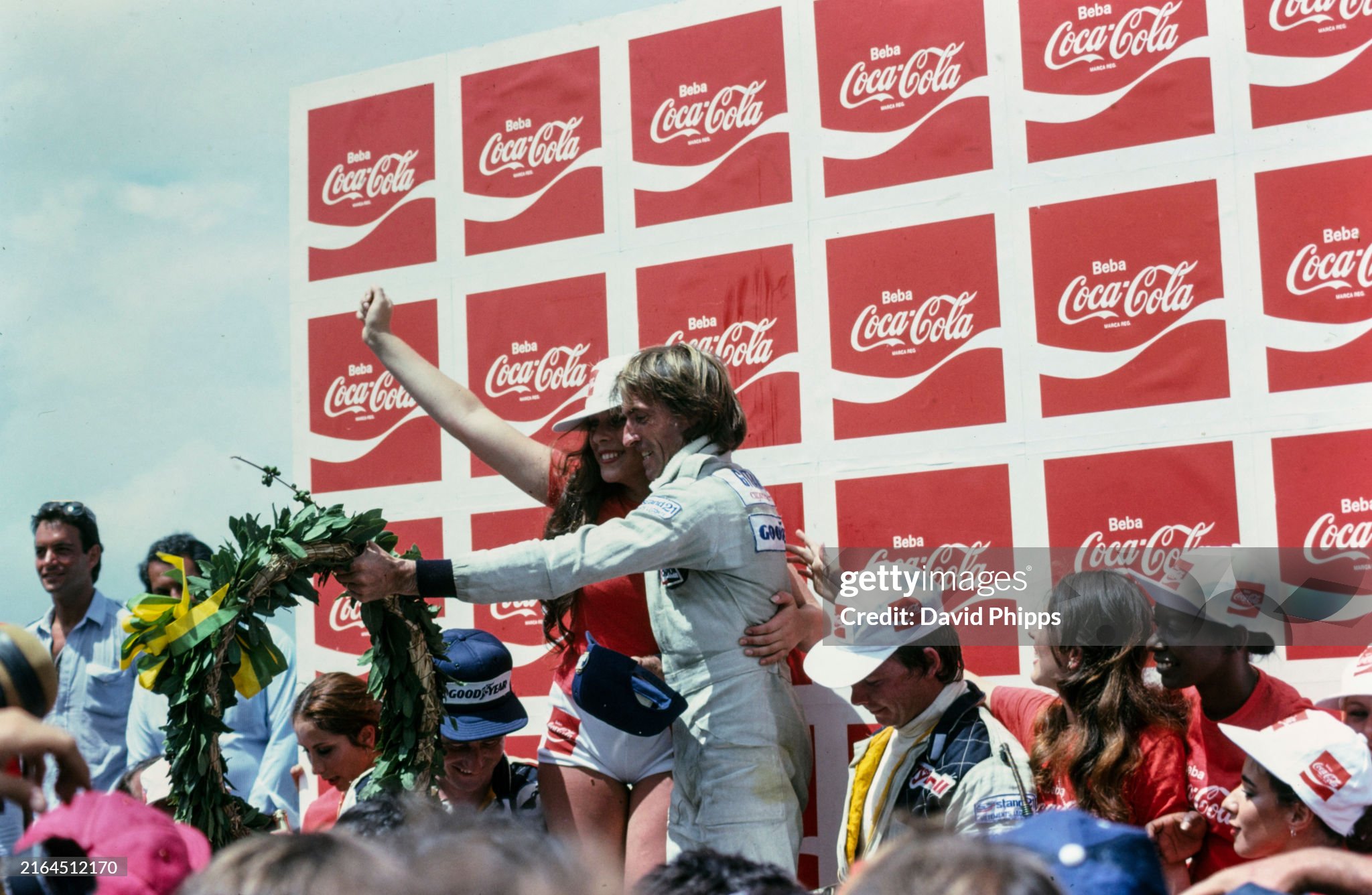 Jacques Laffite celebrates victory on the podium with teammate Patrick Depailler, 2nd position. Didier Pironi stands on the podium in 3rd, despite Carlos Reutemann crossing the line in 3rd position. It was believed he had been disqualified for receiving a push start, promoting Pironi to 3rd. Reutemann would later be reinstated to 3rd position after the Brazilian Grand Prix at Autódromo José Carlos Pace on 04 February 1979. 