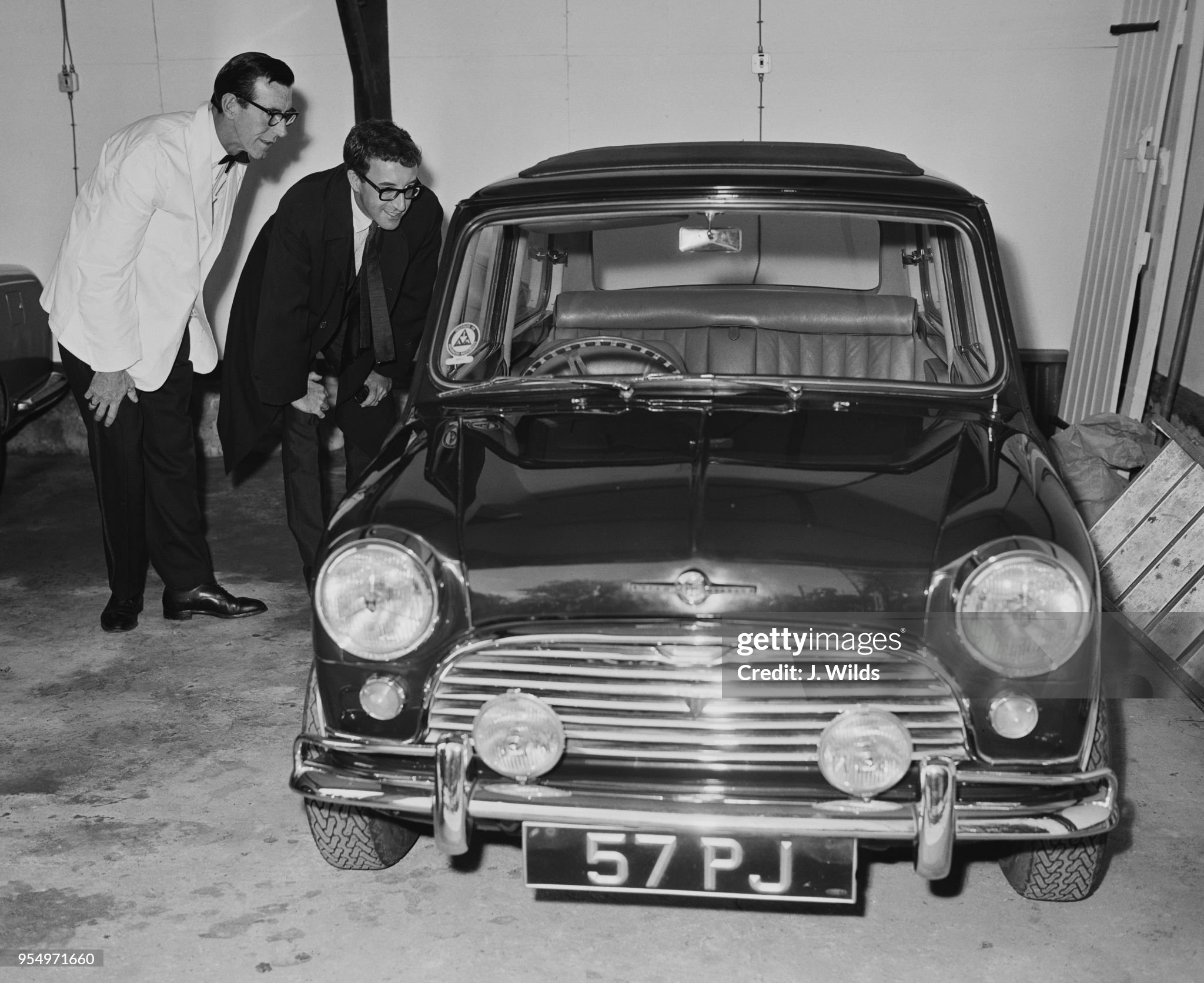 Peter Sellers admires his Mini Cooper upon his return to his home in Surrey, UK, on 8 June 1964.