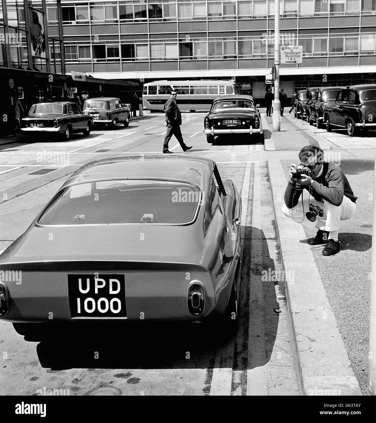 Motor enthusiast Peter Sellers performing the other side of the camera when he was assigned to photo the Unipower GT on 10 May 1966.