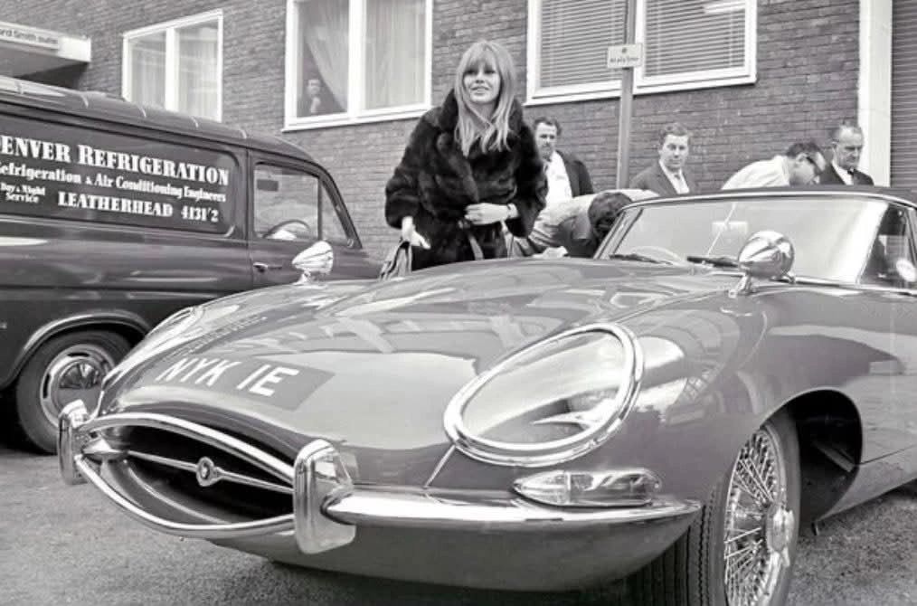 Peter Sellers gifts a new Jaguar E-Type to Britt Ekland in London in 1967.