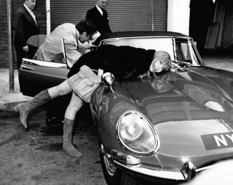 British comedian and actor Peter Sellers presents a gift of a red Jaguar E-Type car to his girlfriend Britt Ekland at Heathrow airport in London on 13th March 1967.