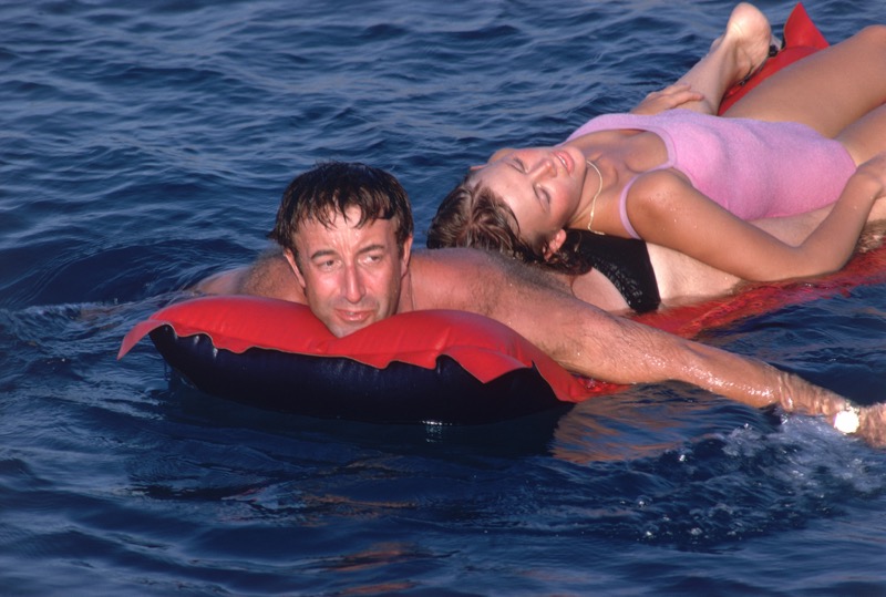 Sharing a lilo, film stars Peter Sellers and his wife Britt Ekland spend their holiday on the Costa Smeralda, circa 1967.