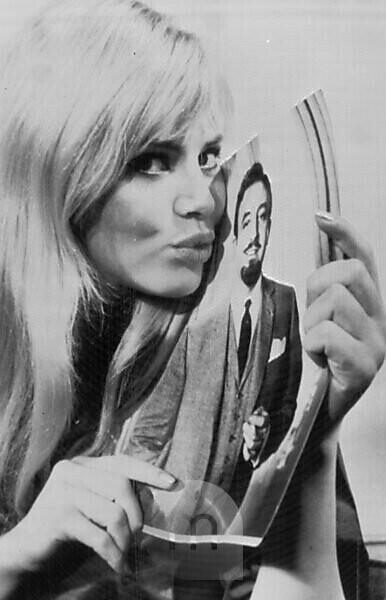 Britt Ekland with a picture of Peter Sellers in New York.