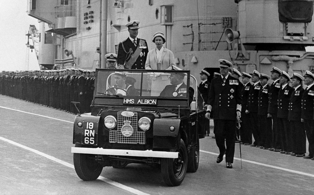 The Queen and Prince Philip in a Land Rover.