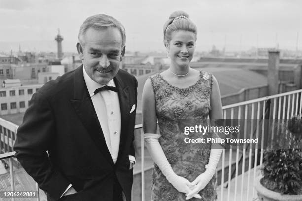 Rainier III, Prince of Monaco (1923-2005) and Princess Grace of Monaco, wearing a dress by Givenchy, attend the Bal des Petits Lits Blancs in Ireland on 06 July 1965.
