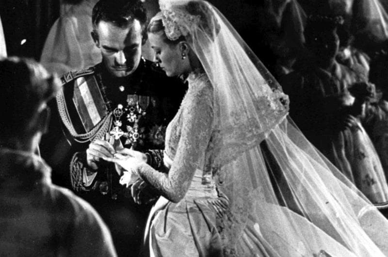 Prince Rainier III of Monaco and Grace Kelly exchange wedding rings.