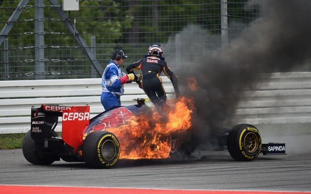 Daniil Kvyat of Russia and Scuderia Toro Rosso jumps out of his car after it caught fire during the German Grand Prix at Hockenheimring on July 20, 2014 in Hockenheim, Germany. 