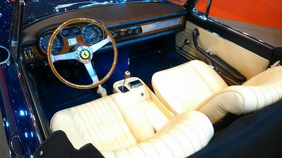The cream leather interior of the 1965 Ferrari 275 GTS.