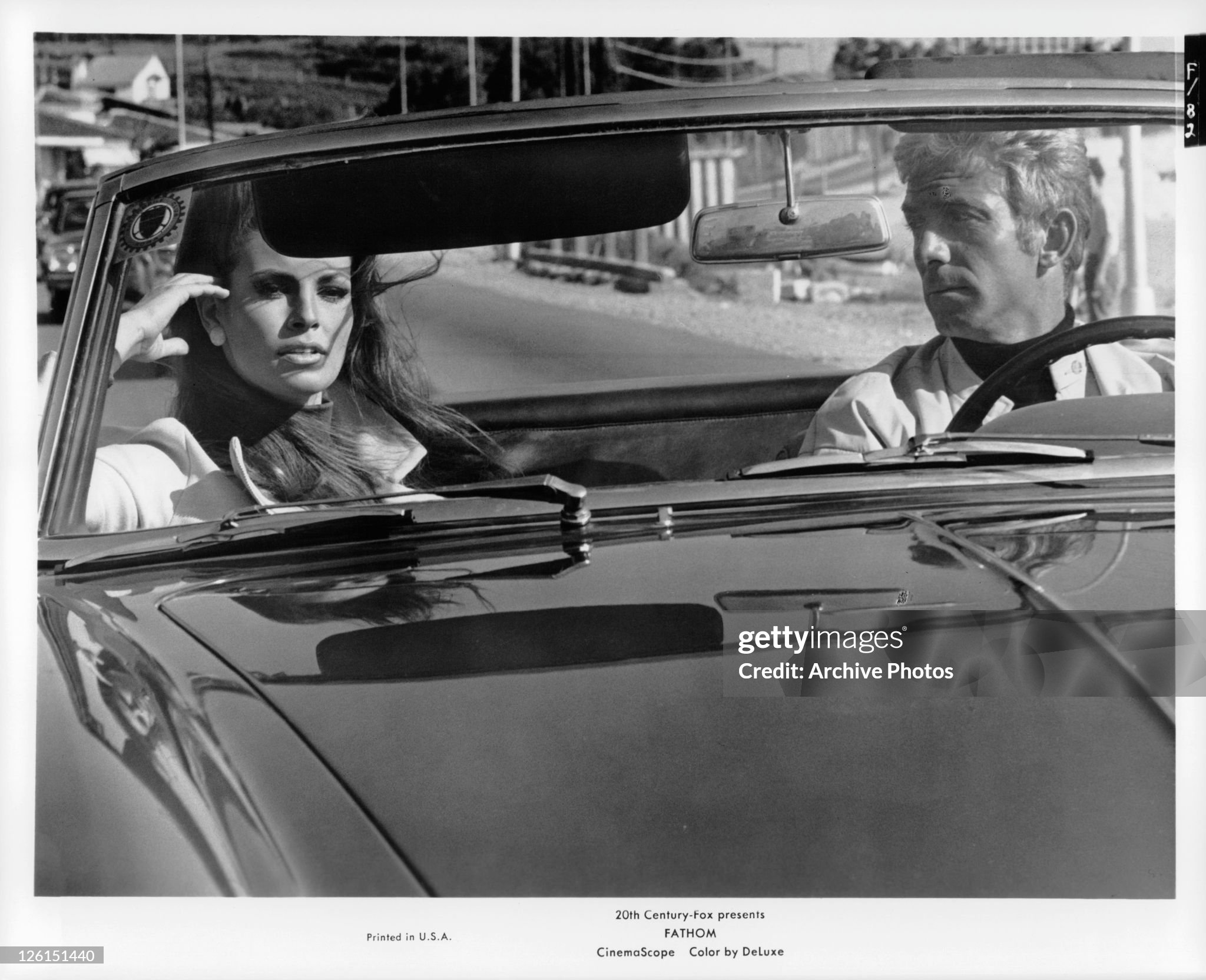 Raquel Welch in passenger sit of car in a scene from the 1967 film 'Fathom'. 
