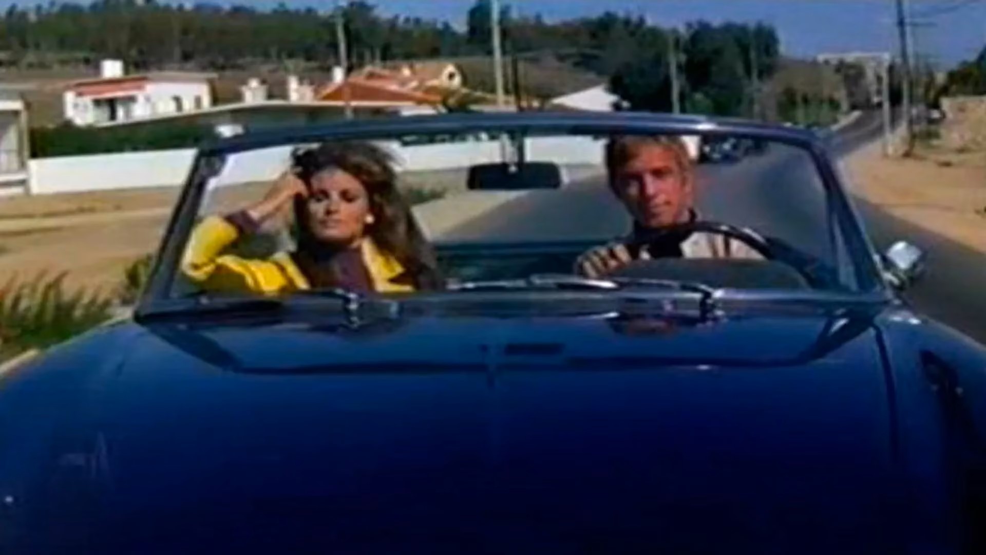 Raquel Welch in passenger sit of car in a scene from the 1967 film 'Fathom'.