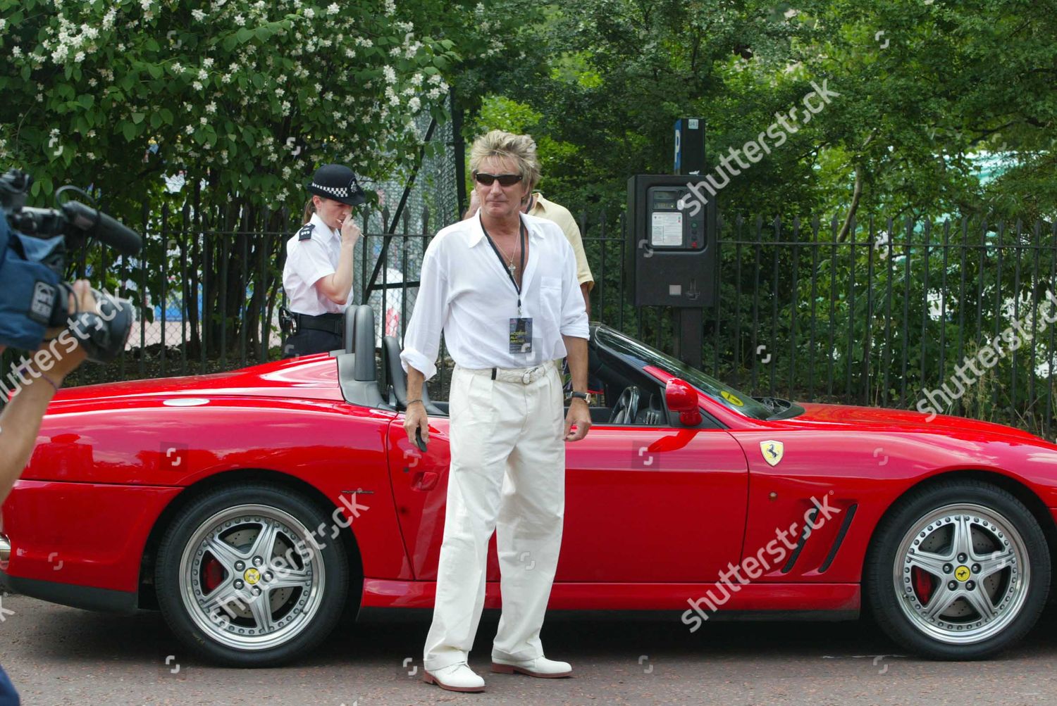 Rod Stewart with his red Ferrari on 16 June 2003. 