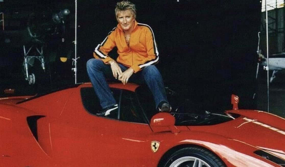 Rod Stewart and his beautiful red Ferrari.