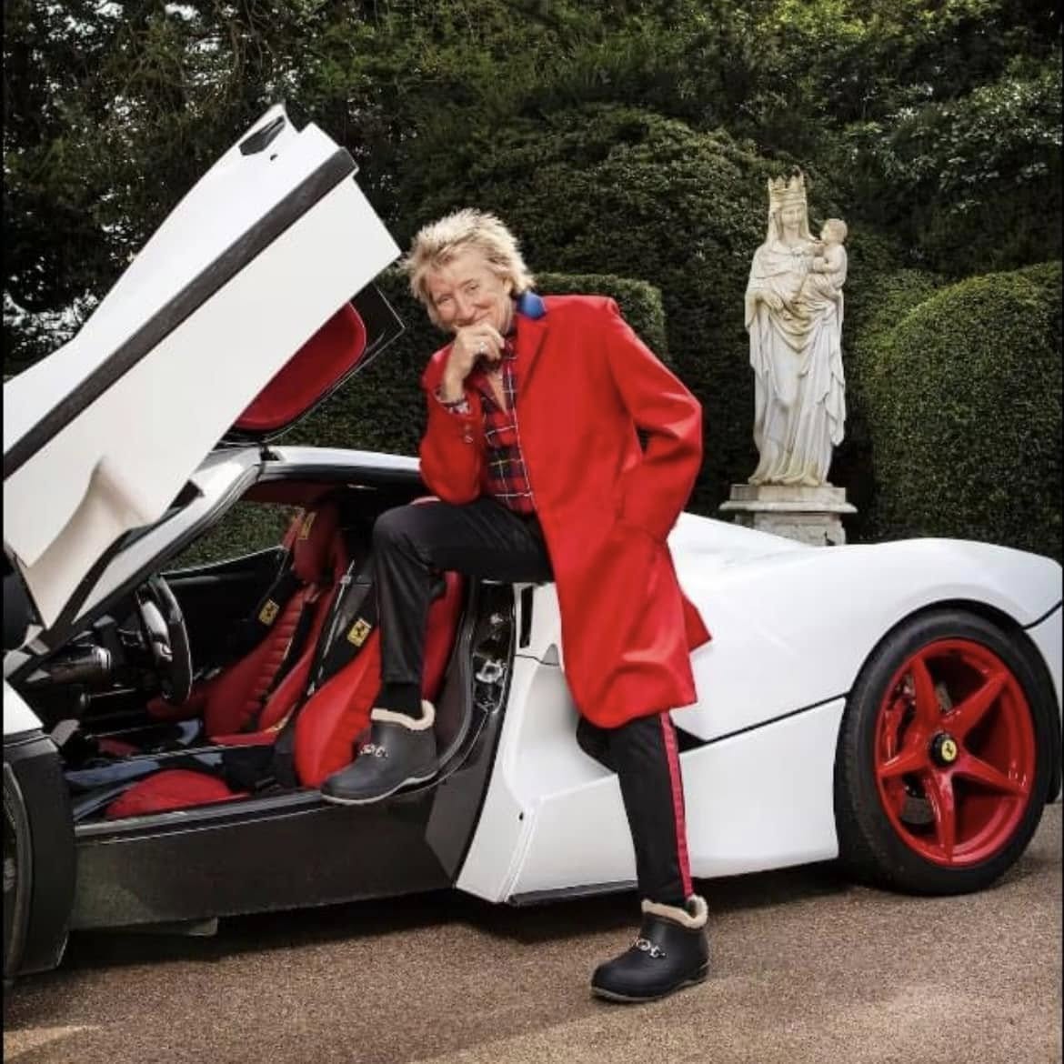 Rod Stewart with one of his white Ferraris.