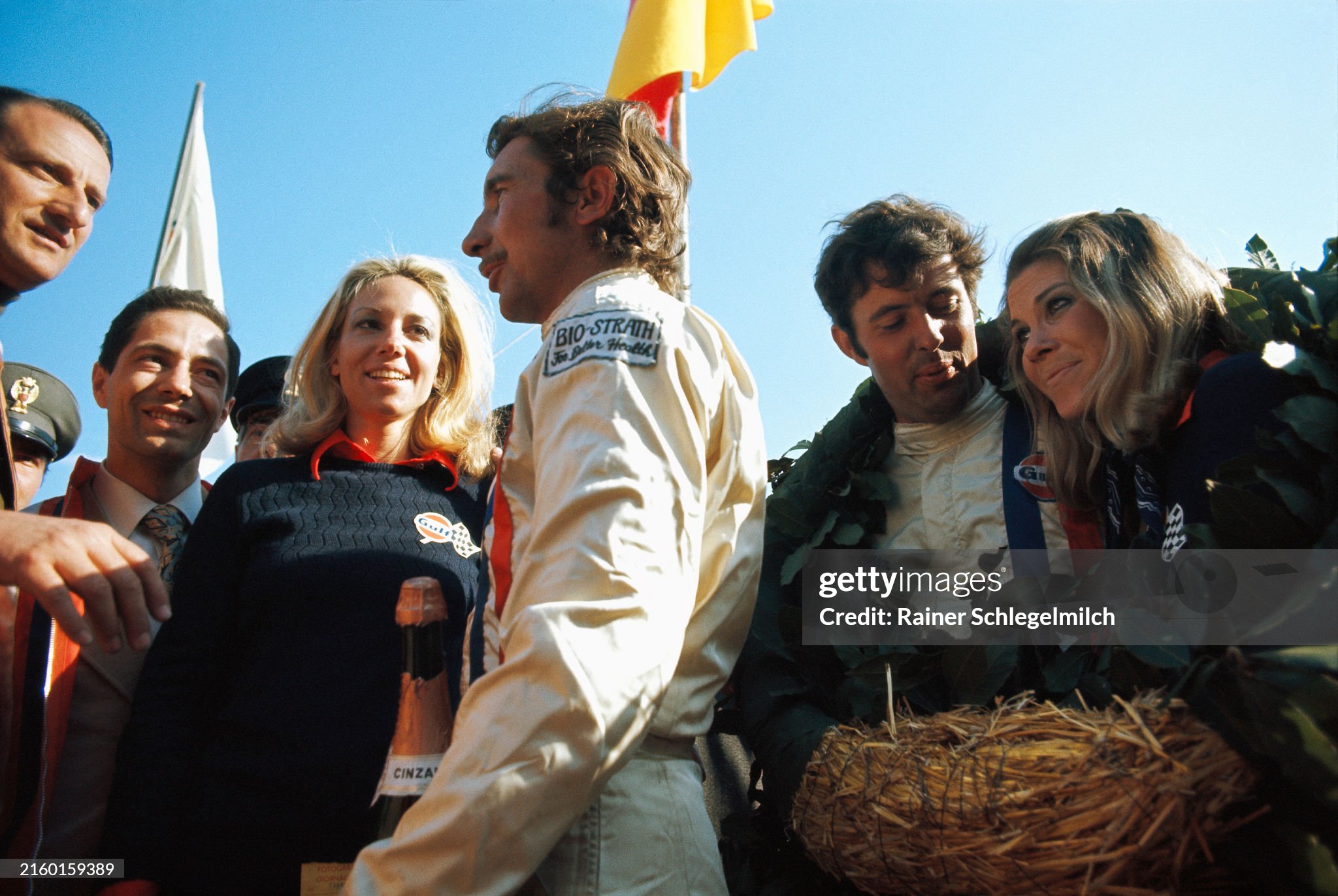 Jo Siffert and Brian Redman celebrate victory on the podium after the Targa Florio in  Italy on May 03, 1970. 